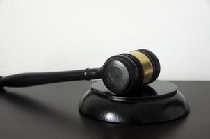 Lawyer gavel on wooden table with white background. photo