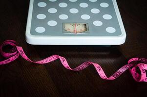Side view of weight scale measure tap and scale machine. Weight loss Concept. photo