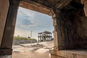 A two-storey granite pavilion on Hemakuta Hill in Hampi photo