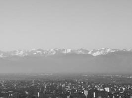 Aerial view of Turin with Alps mountains in black and white photo