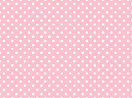 white polka dots over pink background photo