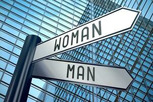 Man and Woman - Signpost With Two Arrows, Office Building in Background photo