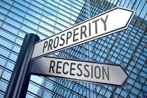 Prosperity or Recession - Signpost With Two Arrows, Office Building in Background photo