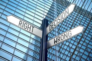 Decision Right or Wrong - Signpost With Three Arrows, Office Building in Background photo