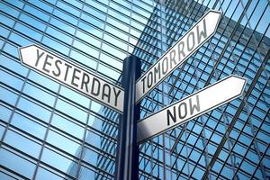 Time Concept - Signpost With Three Arrows, Office Building in Background photo