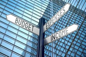 Budget, Expenses, Income - Signpost With Three Arrows, Office Building in Background photo