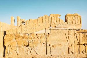 Persepolis, Iran, 2022 - The ancient tombs of Achaemenid dynasty Kings of Persia are carved in rocky cliff in Naqsh-e Rustam, Iran photo