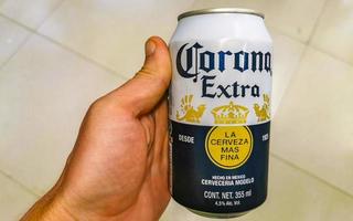 Puerto Escondido Oaxaca Mexico 2023 Holding Corona beer can in the hand Puerto Escondido Mexico. photo