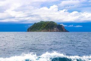 Limestone rocks hills turquoise blue water Phang Nga Bay Thailand. photo