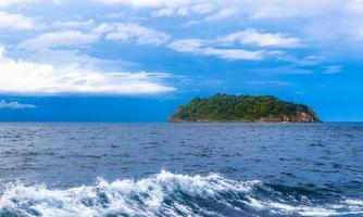 Limestone rocks hills turquoise blue water Phang Nga Bay Thailand. photo