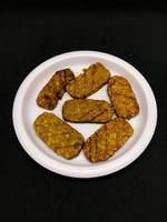 Traditional cuisine from Indonesia. Fried tempe or tempe goreng photo