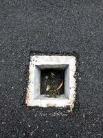 square sewer with black asphalt insulation photo