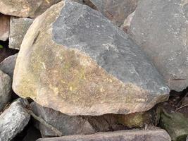 Close up of Stone wall, Rock stacks isolated background photo