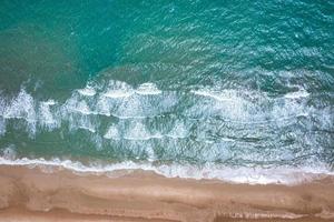 Aerial view image of sea, beach and waves at daytime in Thailand photo