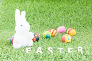 Bunny toy and Easter eggs with text photo