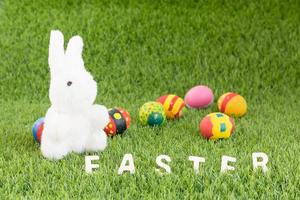 Bunny toy and Easter eggs with text photo