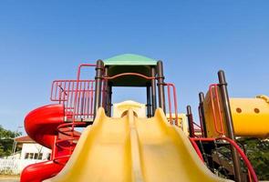 Colorful playground and blue sky photo