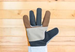 Hand in rough leather glove photo