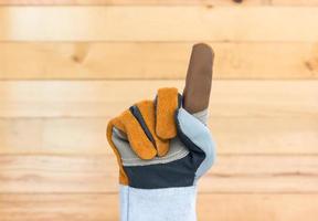 Hand in rough leather glove photo