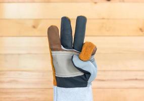 Hand in rough leather glove photo