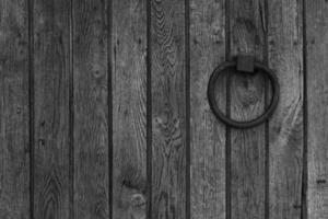 black and white wooden background with metal ring photo