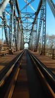 Vertical video. Fast flight over the railway bridge on FPV Drone video