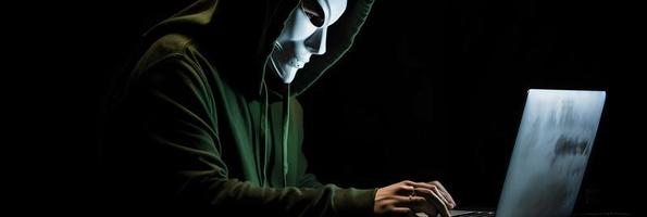 Unveiling the Enigmatic World of Cybercrime. A White Masked Hacker's Front View Amidst Dark Hood and Green Matrix Code Background photo