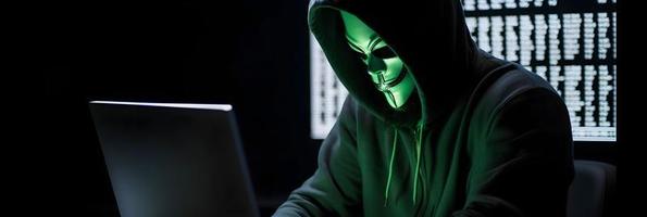 Unveiling the Enigmatic World of Cybercrime. A White Masked Hacker's Front View Amidst Dark Hood and Green Matrix Code Background photo