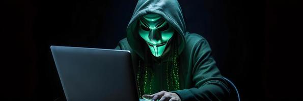 Unveiling the Enigmatic World of Cybercrime. A White Masked Hacker's Front View Amidst Dark Hood and Green Matrix Code Background photo