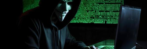 Unveiling the Enigmatic World of Cybercrime. A White Masked Hacker's Front View Amidst Dark Hood and Green Matrix Code Background photo