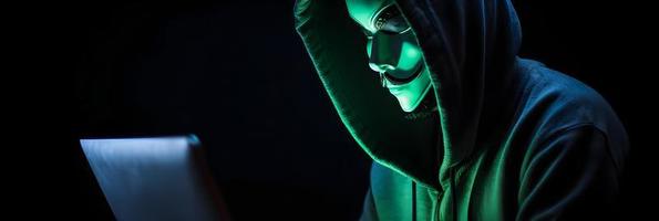 Unveiling the Enigmatic World of Cybercrime. A White Masked Hacker's Front View Amidst Dark Hood and Green Matrix Code Background photo