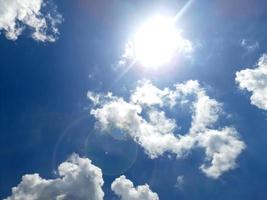 blue sky with cloud closeup and sun bright photo