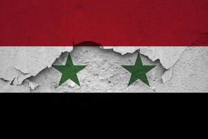 Earthquakes in Syria, flag Syria on a wall with cracks from an earthquake photo