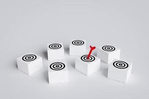 Arrows hit target on square block board with multiple targets. concept of business symbol target audience, selecting a target audience for business success, and achievement of objectives. photo