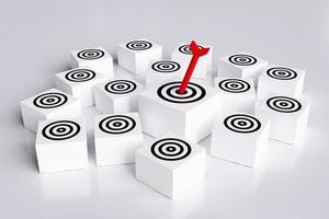 Arrows hit target on square block board with multiple targets. concept of business symbol target audience, selecting a target audience for business success, and achievement of objectives. photo