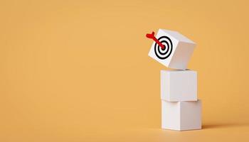 Arrow hits target board on square blocks with copy space. concept of business symbol target audience, selecting a target audience for business success, and achievement of objectives. photo