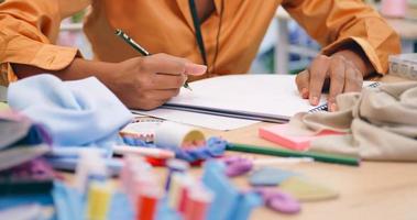 woman is learning the profession of design and tailoring. photo