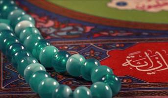 Quran the holy book of muslim religion and Pray Counting Bead photo