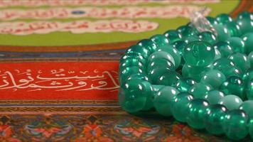 Quran the holy book of muslim religion and Pray Counting Bead photo