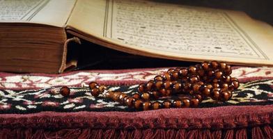 Quran the holy book of muslim religion and Pray Counting Bead photo