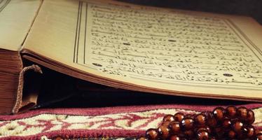 Quran the holy book of muslim religion and Pray Counting Bead photo