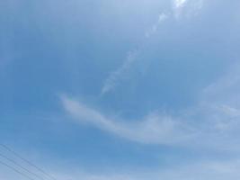 Beautiful white clouds on deep blue sky background. Large bright soft fluffy clouds are cover the entire blue sky. photo