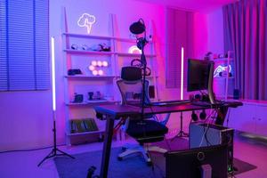 Background of gaming room with neon light , live streaming equipment . photo