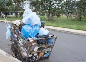 Brasilia, Brazil, DF March 17 2023 Trash and Recyclables loaded up in a cart that homeless people in Brazil, use to collect Recyclable items for resale photo