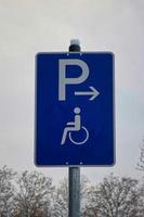 Park signs for disabled persons. Person in a wheel chair. photo