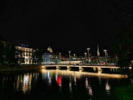 Illuminated the dark. Bridge in Zurich Switzerland at night photo