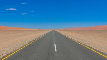 Endless road through the desert photo