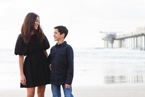 Siblings on the beach photo