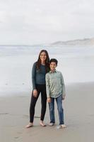 Siblings on the beach photo