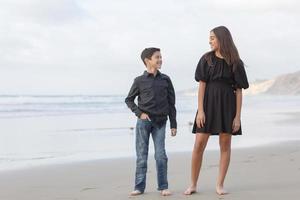 Siblings on the beach photo